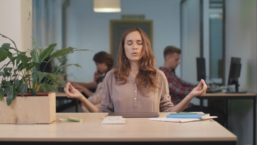 Business woman reading bad news at coworking. Tired woman breathing deep.